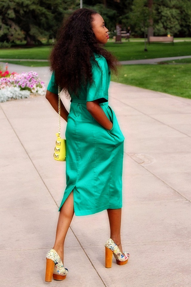 Green midi dress with back slit paired with block heels