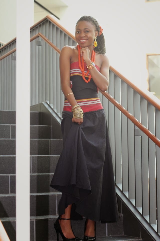 Unique Nigerian African traditional dress paired with tribal chief beads and a sleek pair of studded heels.