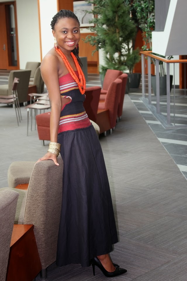 Unique Nigerian African traditional dress paired with tribal chief beads and a sleek pair of studded heels.