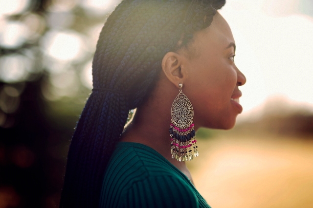 La Passion Voutee statement earrings and braids