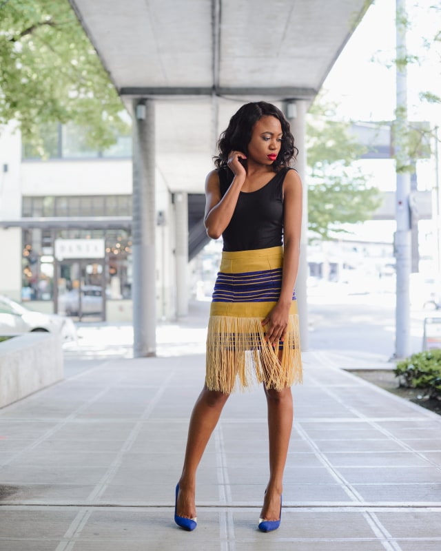 Keeping it simple and chic with a custom-made Nigerian aso oke fringe skirt paired with an open back sleeveless bodysuit. Visit the blog to for more.