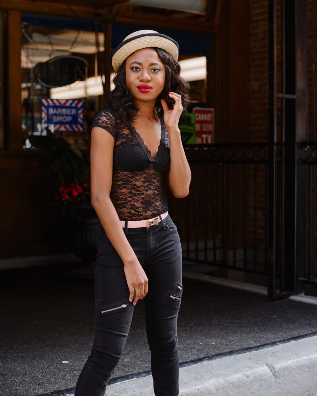 Happily Black with a touch of Pantone's 2016 color, Rose Quartz. Stun others in this backless lace bodysuit, paired with black skinny jeans, a pair of trendy bow pumps and embellished bow belt. Topped up with a straw bowler hat and popping red lipstick. Chic is an understatement. Click for more!