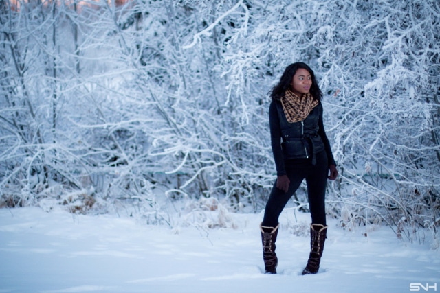 Winter fashion outfit idea wearing a sleeveless winter vest, waterproof insulated winter boots, and Cuddl Duds fleecewear pants, and infinity scarf