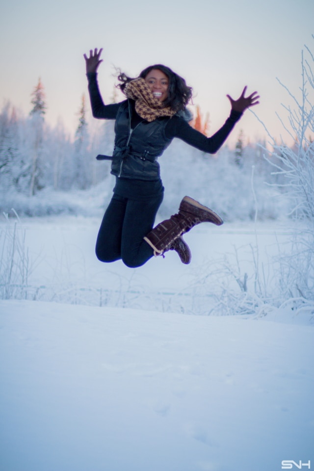 Winter fashion outfit idea wearing a sleeveless winter vest, waterproof insulated winter boots, and Cuddl Duds fleecewear pants, and infinity scarf