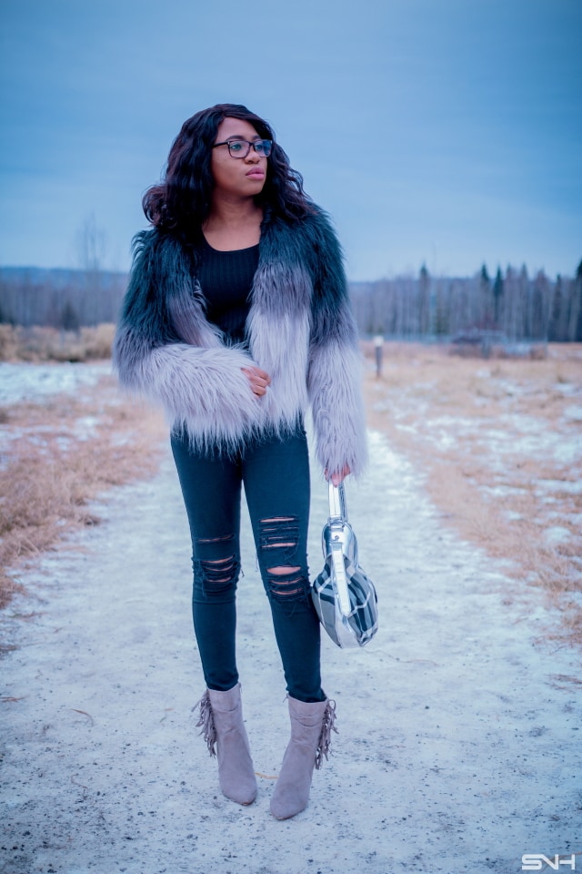 Faux fur jacket outfit | A trendy fall street style combining ombre faux fur coat, ripped black jeans, fringe ankle booties. Fashion blogger | Alaska | Black blogger | Fall fashion | Ripped denim