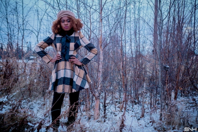 Fitted Pattern Coat + Thigh High Boots | Totally crushing over her plaid coat. The fact that she styled this street style look with a thigh high boots makes it perfect for the winter.