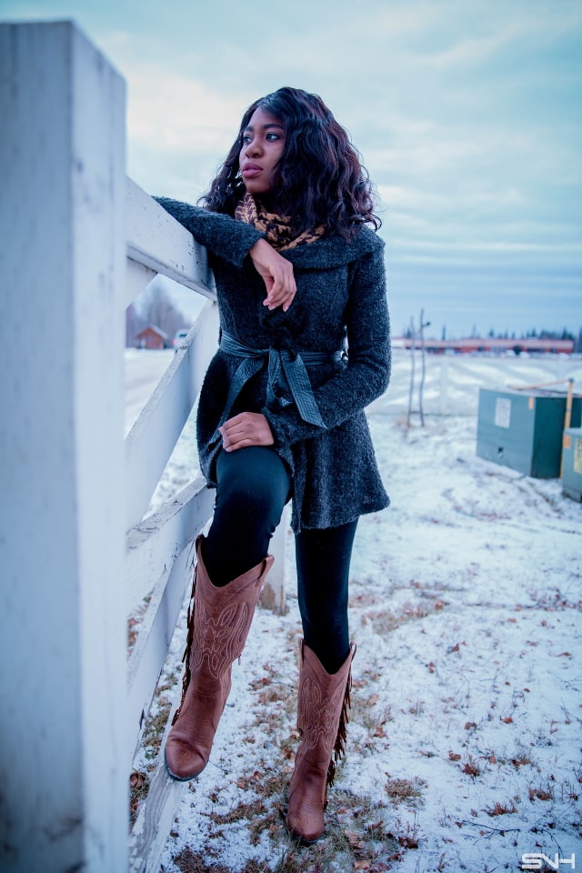 A chic way to wear a cardigan sweater this spring is to pair it with unusual pieces like she did with a fringe detailed cowboy boots. Chunky sweater | Peplum hem | Cardigan | Alaska fashion | Travel to Alaska