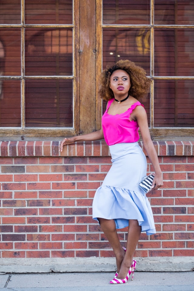 Peplum skirt and scallop edge tops are summer style must-haves. I'm obsessed with the contrast between the bright pink sleeveless top and pastel blue skirt. The striped heels and box clutch are the perfect accessories too. | Summer fashion | Fashion blogger | Spring style | Spring outfit | Black blogger | Spring fashion | Summer looks | Summer hair | Street Style |