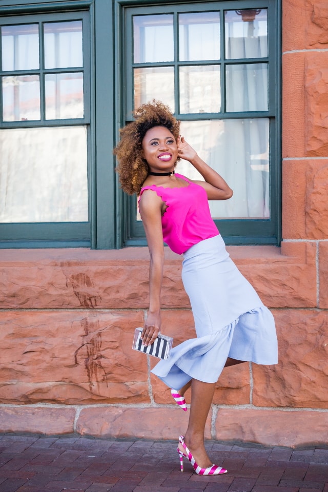 Peplum skirt and scallop edge tops are summer style must-haves. I'm obsessed with the contrast between the bright pink sleeveless top and pastel blue skirt. The striped heels and box clutch are the perfect accessories too. | Summer fashion | Fashion blogger | Spring style | Spring outfit | Black blogger | Spring fashion | Summer looks | Summer hair | Street Style |