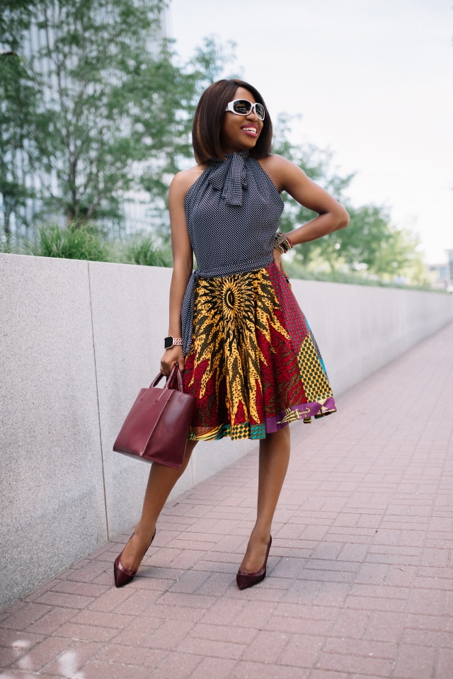 Crushing hard on her sunglasses! Love how this super cute UV polarized sunnies fits her face shape. Need her fit and flare African print dress too! African prints | Nigerian fashion | African fashion | African print clothes | ankara jackets | Dashiki Dress | African clothing | Dashiki skirt | African print styles | African print dress | African attire | Xperio UV lenses | Ray Ban | sunglasses