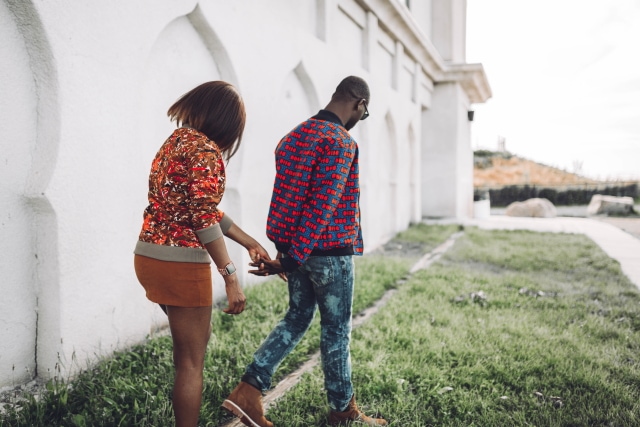 Couple goals! They look so stylish in their African print bomber jacket. ❤️ ❤️ Love how they're subtly matching with her suede mini skirt snd his tan Timberland. Ankara, Dutch wax, Kente, Kitenge, dashiki, ankara bomber jacket, African fashion, African clothing, African prints, Nigerian style, Ghanaian fashion, bomber jacket, Kenya fashion, Nigerian fashion