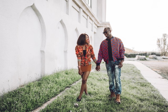 Couple goals! They look so stylish in their African print bomber jacket. ❤️ ❤️ Love how they're subtly matching with her suede mini skirt snd his tan Timberland. Ankara, Dutch wax, Kente, Kitenge, dashiki, ankara bomber jacket, African fashion, African clothing, African prints, Nigerian style, Ghanaian fashion, bomber jacket, Kenya fashion, Nigerian fashion