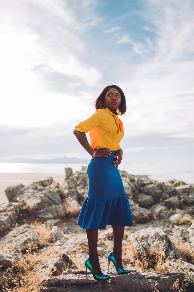 Never thought blue & yellow would look this good! Very work appropriate and stylish with the neck tie bow and peplum midi skirt. ?? Work style, dressy outfit, women's style, black girl, Nigerian blogger, pussy bow top, neoprene skirt, iridescent hologram heels