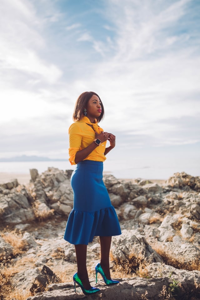 Never thought blue & yellow would look this good! Very work appropriate and stylish with the neck tie bow and peplum midi skirt. ?? Work style, dressy outfit, women's style, black girl, Nigerian blogger, pussy bow top, neoprene skirt, iridescent hologram heels