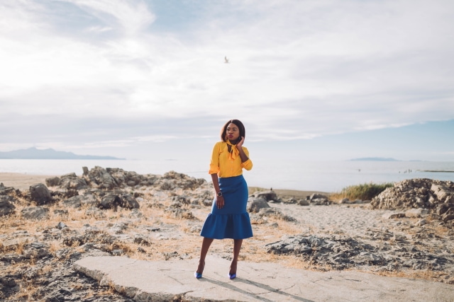 Never thought blue & yellow would look this good! Very work appropriate and stylish with the neck tie bow and peplum midi skirt. ?? Work style, dressy outfit, women's style, black girl, Nigerian blogger, pussy bow top, neoprene skirt, iridescent hologram heels