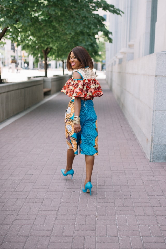 Such a stunningly irresistible African print romper! I wouldn't be surprised if she stopped traffic wearing this elegant mixed print ankara African style. The cold shoulder, lace detail and matching blue heels definitely make this outfit a hit! Adding to my wishlist as a gift idea today. Fall style, dutch wax, kente, kitenge, dashiki, African styles, African prints, Nigerian style, senegal fashion #ankara #africanprint #kente #ootd #romper