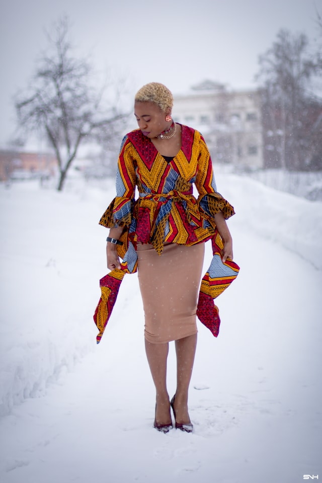 If you thought African print couldn't get better, you'd be surprised! Totally lusting on this handmade African print wrap blouse. The colors and style make a bold statement. Definitely not one for the faint of heart. Loving the contemporary twist with a jersey midi skirt and classic pumps. All that peplum detail got me obsessed! #ankara #africanprint #ankarafashion #nigerian