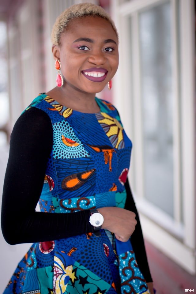 This African print peplum top has me obsessed with ankara styles and patchwork designs. Fashion blogger, Louisa shares a breathtaking patchwork ankara top as part of a 20+ days of African print fashion. Looking for a upgraded casual way to rock African print today, check out this look from Day 2 of the series by With Flare Designs. The pops of blue and orange contrasts beautifully on the black denim and bodysuit. #africanprint #ankara #ankarafashion #kente