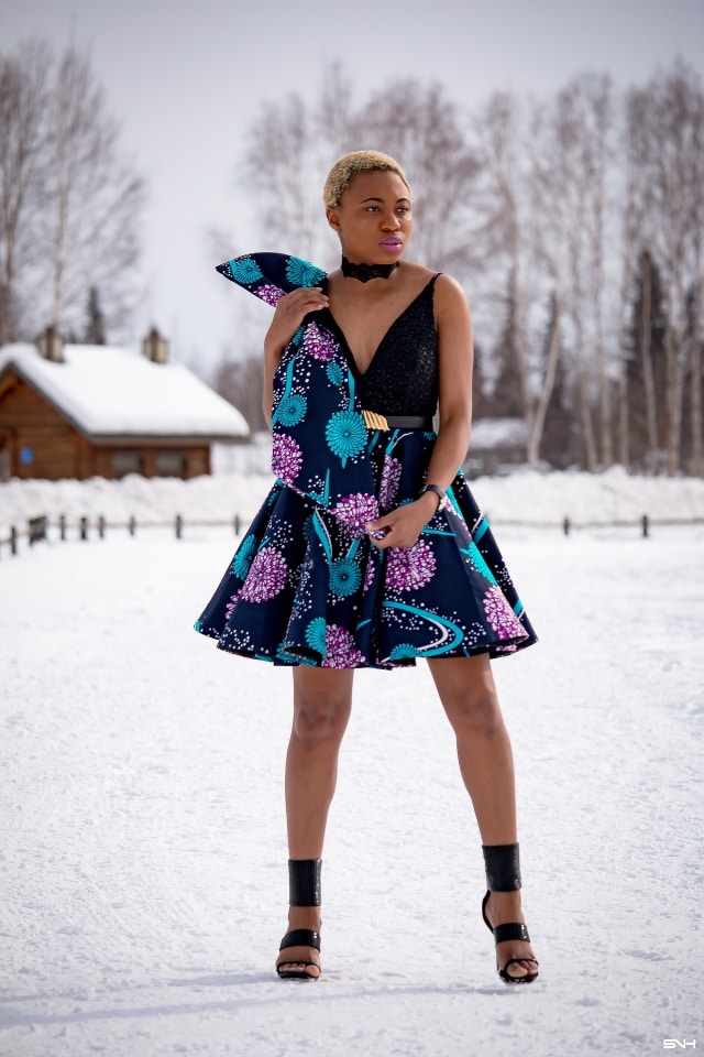 Millennial fashion and beauty blogger, Louisa takes us on an epic fashion series showcasing some of the most spectacular, wearable African print styles we've ever seen! Case in point, this elaborate African print cocktail dress made with premium ankara fabric mixed with a sequin V neck fabric and an exposed back. And oh, she makes winter in Alaska look so balmy! Dashiki, African print dress, African fashion, African women dresses, African prints, Nigerian style, Nigerian fashion