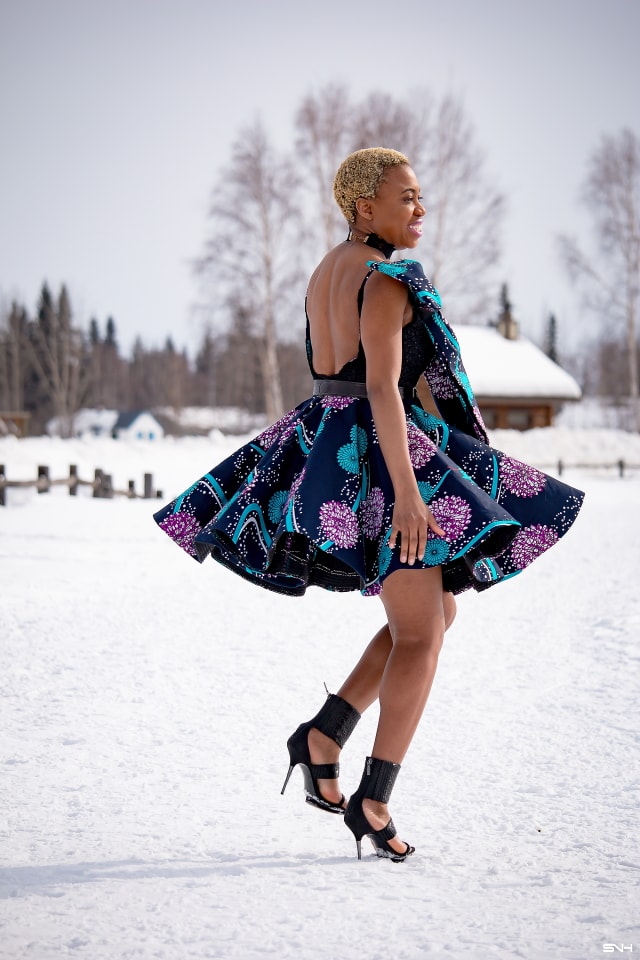 Millennial fashion and beauty blogger, Louisa takes us on an epic fashion series showcasing some of the most spectacular, wearable African print styles we've ever seen! Case in point, this elaborate African print cocktail dress made with premium ankara fabric mixed with a sequin V neck fabric and an exposed back. And oh, she makes winter in Alaska look so balmy! Dashiki, African print dress, African fashion, African women dresses, African prints, Nigerian style, Nigerian fashion
