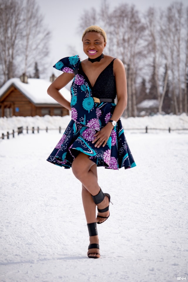 Millennial fashion and beauty blogger, Louisa takes us on an epic fashion series showcasing some of the most spectacular, wearable African print styles we've ever seen! Case in point, this elaborate African print cocktail dress made with premium ankara fabric mixed with a sequin V neck fabric and an exposed back. And oh, she makes winter in Alaska look so balmy! Dashiki, African print dress, African fashion, African women dresses, African prints, Nigerian style, Nigerian fashion