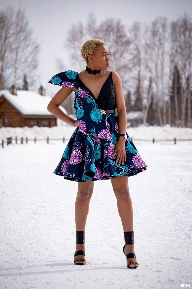 Millennial fashion and beauty blogger, Louisa takes us on an epic fashion series showcasing some of the most spectacular, wearable African print styles we've ever seen! Case in point, this elaborate African print cocktail dress made with premium ankara fabric mixed with a sequin V neck fabric and an exposed back. And oh, she makes winter in Alaska look so balmy! Dashiki, African print dress, African fashion, African women dresses, African prints, Nigerian style, Nigerian fashion