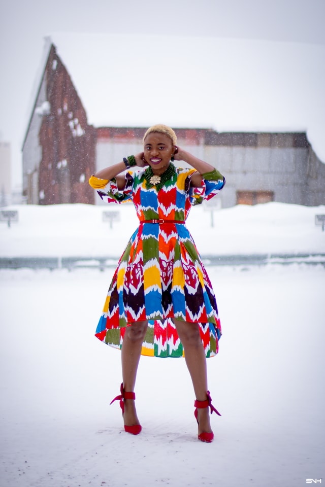 Louisa Moje is a Nigerian fashion blogger who runs La Passion Voutee. Her refined style, vibrant and elegant African print outfits invite you on a colorful and artist journey. Her ankara fashion series like this African print high-low dress featuring African print designers around the world has been a hit. The way she gracefully showcases these beautiful prints against the Alaska snow make her looks stand out. #ankara #africanprint #ankarafashion #nigerian