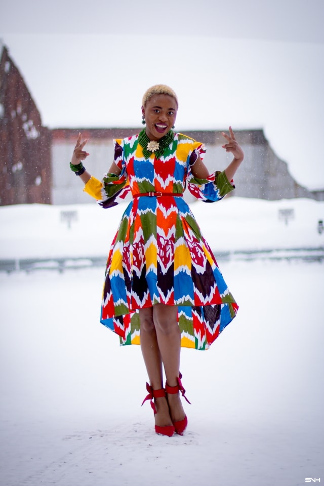 Louisa Moje is a Nigerian fashion blogger who runs La Passion Voutee. Her refined style, vibrant and elegant African print outfits invite you on a colorful and artist journey. Her ankara fashion series like this African print high-low dress featuring African print designers around the world has been a hit. The way she gracefully showcases these beautiful prints against the Alaska snow make her looks stand out. #ankara #africanprint #ankarafashion #nigerian