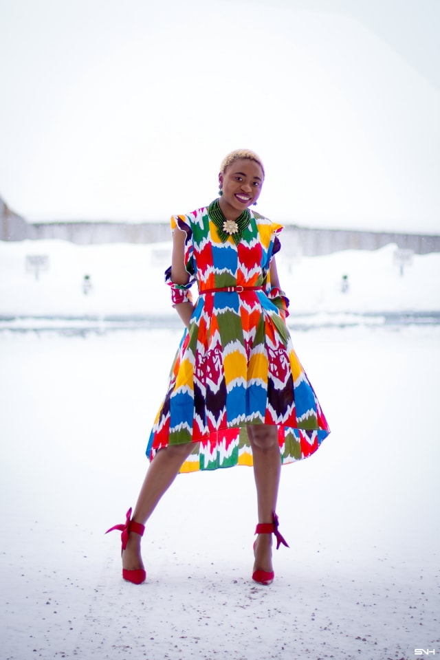 Louisa Moje is a Nigerian fashion blogger who runs La Passion Voutee. Her refined style, vibrant and elegant African print outfits invite you on a colorful and artist journey. Her ankara fashion series like this African print high-low dress featuring African print designers around the world has been a hit. The way she gracefully showcases these beautiful prints against the Alaska snow make her looks stand out. #ankara #africanprint #ankarafashion #nigerian