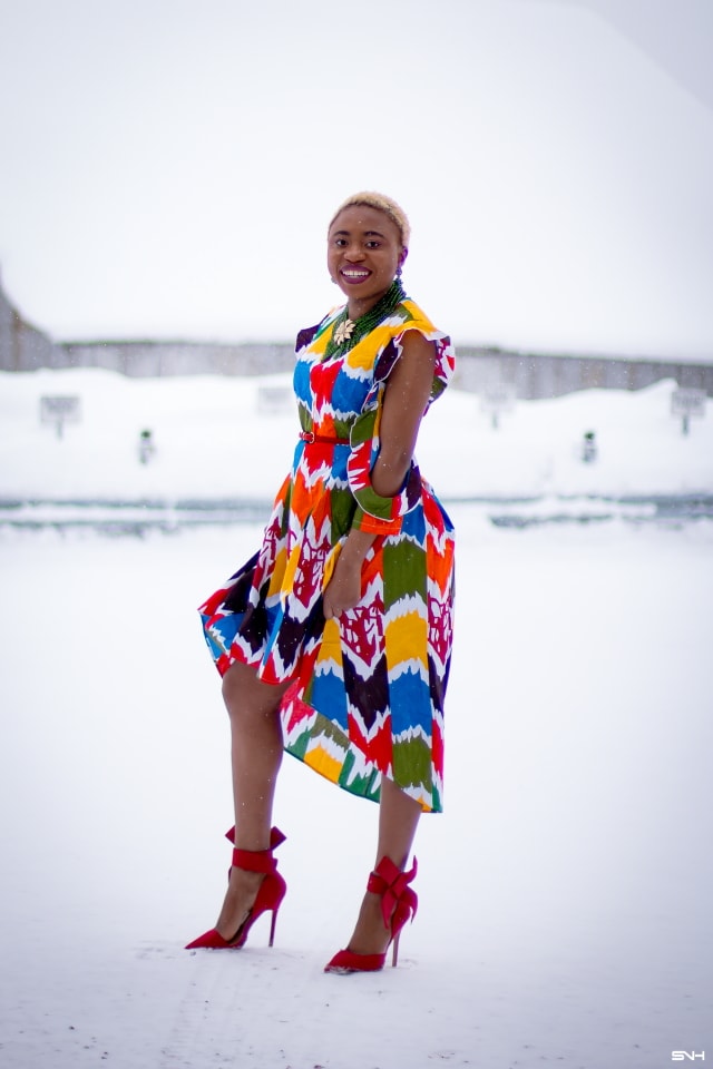 Louisa Moje is a Nigerian fashion blogger who runs La Passion Voutee. Her refined style, vibrant and elegant African print outfits invite you on a colorful and artist journey. Her ankara fashion series like this African print high-low dress featuring African print designers around the world has been a hit. The way she gracefully showcases these beautiful prints against the Alaska snow make her looks stand out. #ankara #africanprint #ankarafashion #nigerian