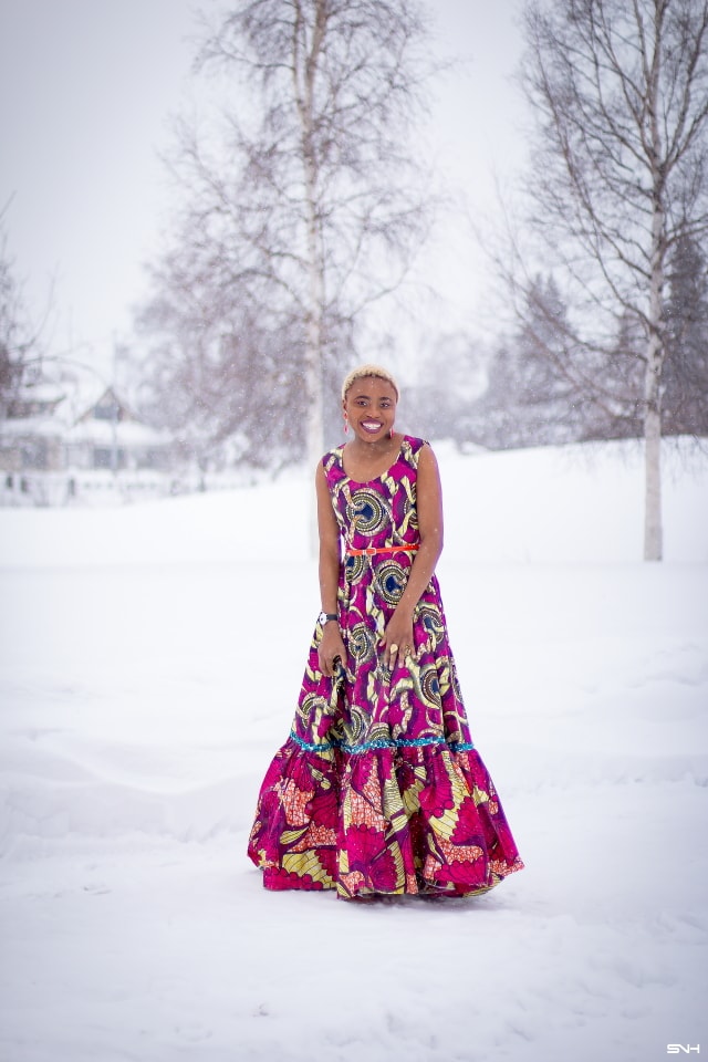 This African wax print maxi dress has me has me oohing and ahhing about ankara styles and summer dresses. Style blogger, Louisa serves major major hotness in this jawdropping ankara dress as part of a 20+ days of African print fashion. The perfect dress to rock to a balmy summer wedding. This outfit from Day 13 of the series is by With Flare Designs. The pops of pink, blue and orange sine beautifully in the background. #africanprint #ankara #ankarafashion #kente