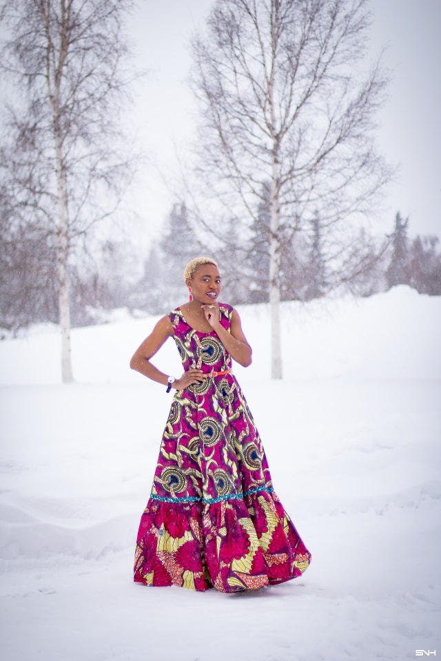 This African wax print maxi dress has me has me oohing and ahhing about ankara styles and summer dresses. Style blogger, Louisa serves major major hotness in this jawdropping ankara dress as part of a 20+ days of African print fashion. The perfect dress to rock to a balmy summer wedding. This outfit from Day 13 of the series is by With Flare Designs. The pops of pink, blue and orange sine beautifully in the background. #africanprint #ankara #ankarafashion #kente