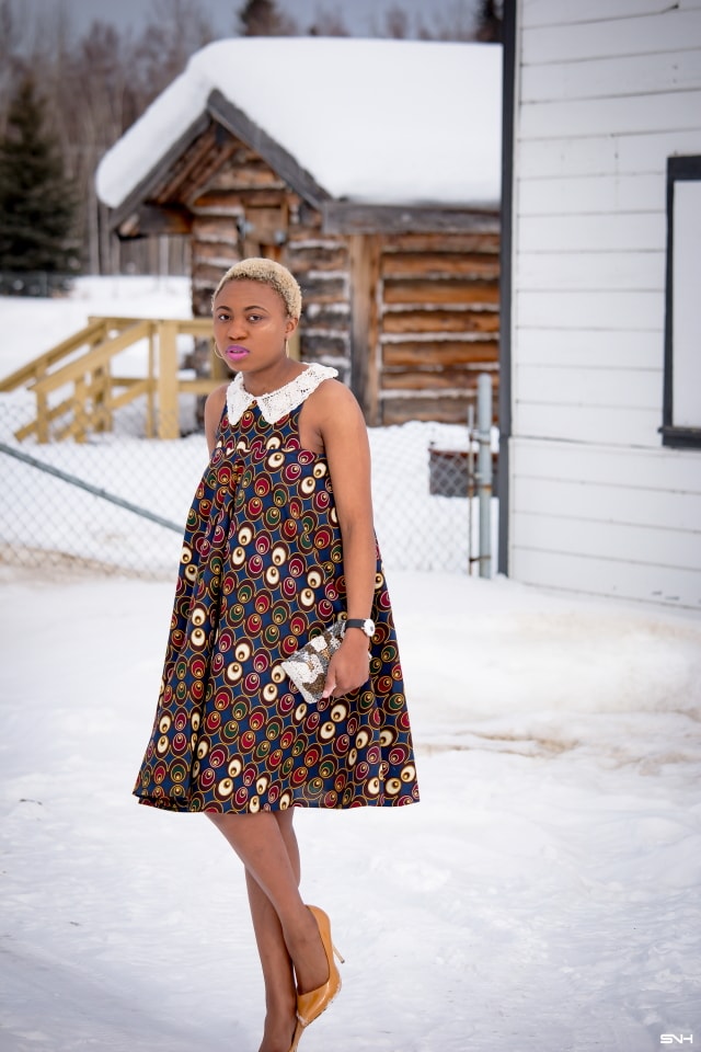 Fashion blogger, Louisa takes us on a month-long series rocking the prettiest African print styles. This ankara flared dress as me oohing and ahhing. The perfect dress for a balmy summer dress. The free-flowing form makes the African print dress a breathable and comfortable option. Love how she makes winter look so warm! #ankara #africanprint #ankarafashion Kitenge, Dashiki, African print dress, African fashion, African women dresses, African prints, Nigerian styleNigerian fashion