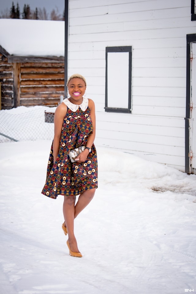 Fashion blogger, Louisa takes us on a month-long series rocking the prettiest African print styles. This ankara flared dress as me oohing and ahhing. The perfect dress for a balmy summer dress. The free-flowing form makes the African print dress a breathable and comfortable option. Love how she makes winter look so warm! #ankara #africanprint #ankarafashion Kitenge, Dashiki, African print dress, African fashion, African women dresses, African prints, Nigerian styleNigerian fashion