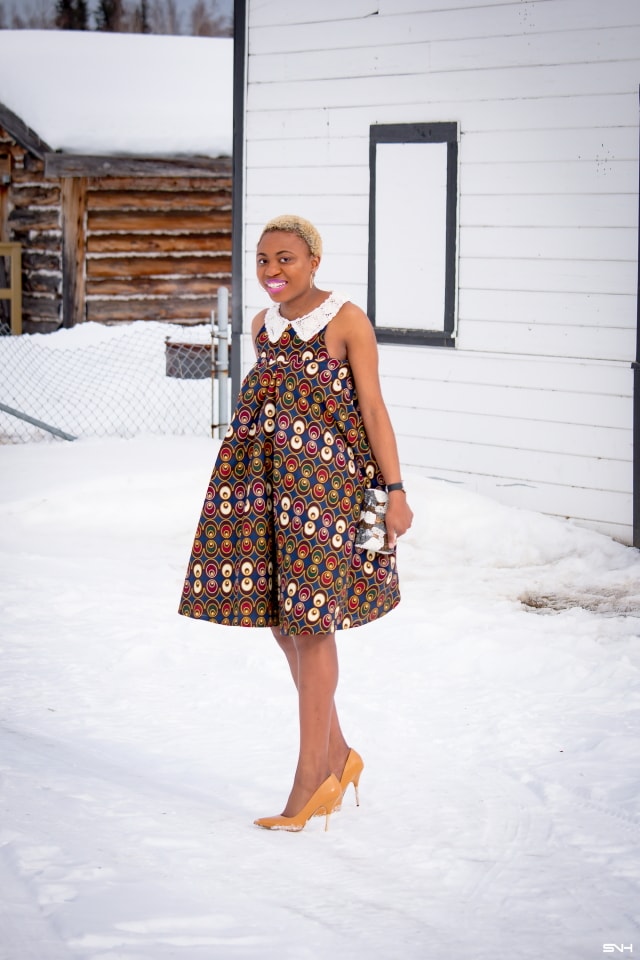 Fashion blogger, Louisa takes us on a month-long series rocking the prettiest African print styles. This ankara flared dress as me oohing and ahhing. The perfect dress for a balmy summer dress. The free-flowing form makes the African print dress a breathable and comfortable option. Love how she makes winter look so warm! #ankara #africanprint #ankarafashion Kitenge, Dashiki, African print dress, African fashion, African women dresses, African prints, Nigerian styleNigerian fashion