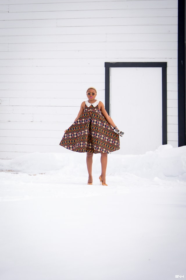 Fashion blogger, Louisa takes us on a month-long series rocking the prettiest African print styles. This ankara flared dress as me oohing and ahhing. The perfect dress for a balmy summer dress. The free-flowing form makes the African print dress a breathable and comfortable option. Love how she makes winter look so warm! #ankara #africanprint #ankarafashion Kitenge, Dashiki, African print dress, African fashion, African women dresses, African prints, Nigerian styleNigerian fashion