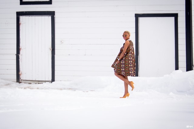 Fashion blogger, Louisa takes us on a month-long series rocking the prettiest African print styles. This ankara flared dress as me oohing and ahhing. The perfect dress for a balmy summer dress. The free-flowing form makes the African print dress a breathable and comfortable option. Love how she makes winter look so warm! #ankara #africanprint #ankarafashion Kitenge, Dashiki, African print dress, African fashion, African women dresses, African prints, Nigerian styleNigerian fashion