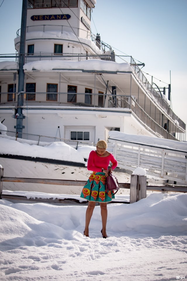 Day 22: Preppy Ankara Printed Skirt | Everyday style for the fashionable woman. Nigerian style blogger takes us on an epic ride wearing the most enviable African print clothes for 30 days. Check out how she paired this signature preppy ankara printed skirt with a modern touch of a boat neck / off the shoulder top. The burgundy bucket purse and matching heels seals this look to perfection! #africanprint #ankara #fashionblogger