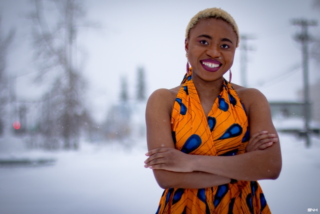 OMG where can I get this jaw-dropping ankara print dress? I need African print dresses like this multiway wax print dress that can be worn in multiple ways. And the way Louisa styled this dress as part of her 30 days of African outfits has me drooling. Such a unique contrast wearing a summer dress in the heart of winter! #africanprint #ankarafashion African prints, Nigerian fashion, African fashion, African print dresses, African dresses