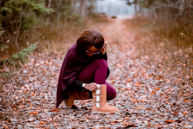 A winter outfit pairing a cowl neck poncho layered over an insulated fleecewear and super chic and comfortable burgundy faux suede leggings and the coziest Koolaburra by UGG boots. This is a practical and fashionable look that can be worn and remixed with other wardrobe essentials while keeping you warm on cold weather days. This post is all about winter fashion, fall fashion, New Jersey fashion blogger, black style blogger.