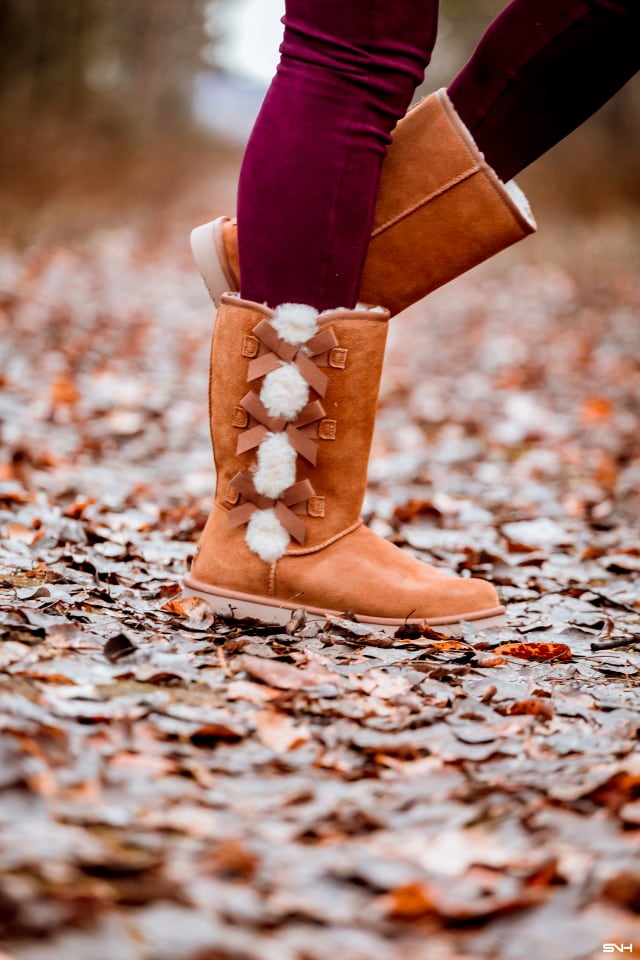 A winter outfit pairing a cowl neck poncho layered over an insulated fleecewear and super chic and comfortable burgundy faux suede leggings and the coziest Koolaburra by UGG boots. This is a practical and fashionable look that can be worn and remixed with other wardrobe essentials while keeping you warm on cold weather days. This post is all about winter fashion, fall fashion, New Jersey fashion blogger, black style blogger.