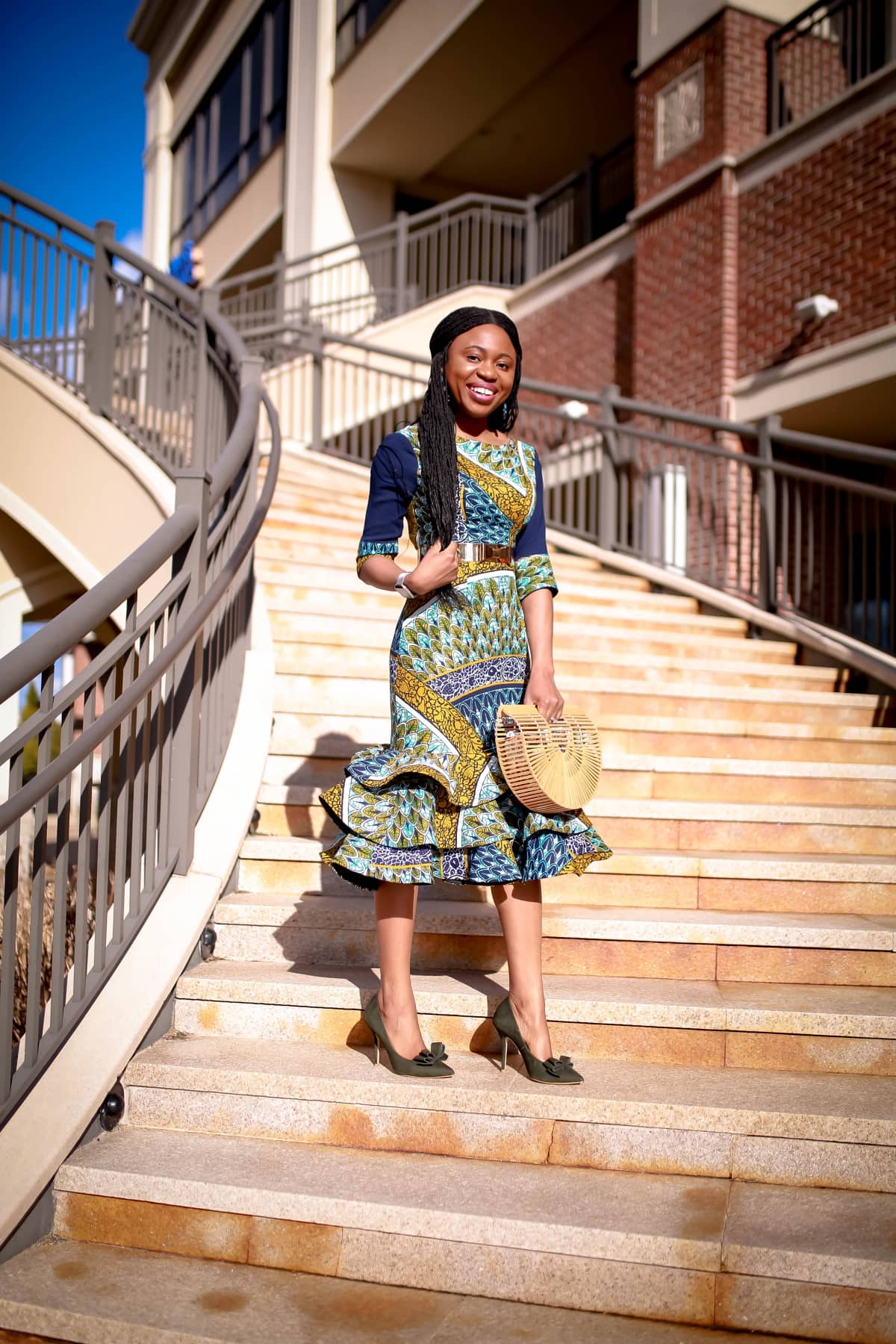 An African midi dress can be dressed up or down for special occasions. Here are two easy ways to style this ankara dress plus how to get a custom piece or make one for yourself! All about African clothing, how to wear, African attire, African fashion dresses #ankarafashion #africanfashion #africanprint #nigerianfashion #womensafricanfashion