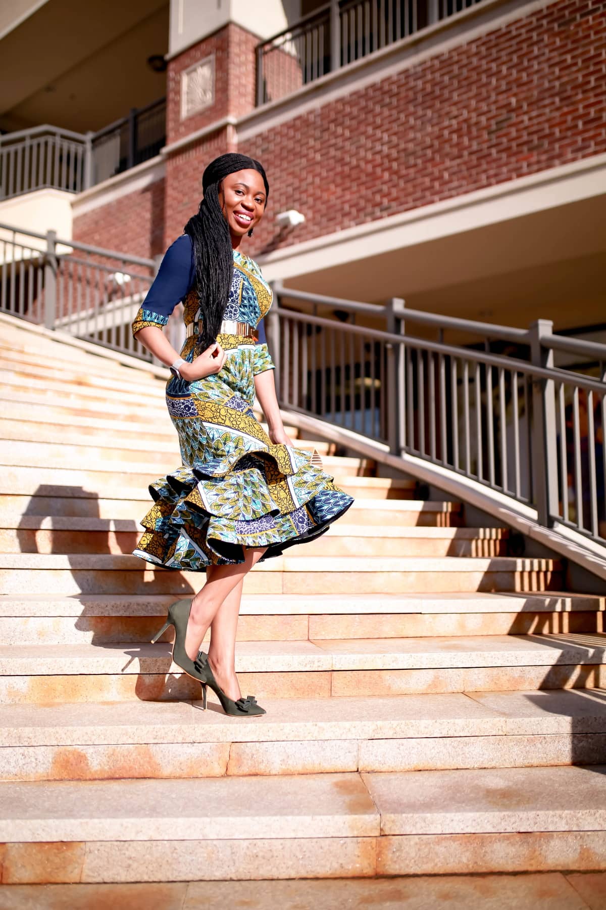 An African midi dress can be dressed up or down for special occasions. Here are two easy ways to style this ankara dress plus how to get a custom piece or make one for yourself! All about African clothing, how to wear, African attire, African fashion dresses #ankarafashion #africanfashion #africanprint #nigerianfashion #womensafricanfashion