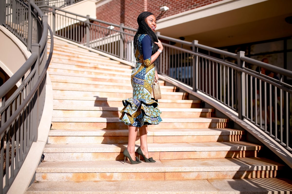 An African midi dress can be dressed up or down for special occasions. Here are two easy ways to style this ankara dress plus how to get a custom piece or make one for yourself! All about African clothing, how to wear, African attire, African fashion dresses #ankarafashion #africanfashion #africanprint #nigerianfashion #womensafricanfashion