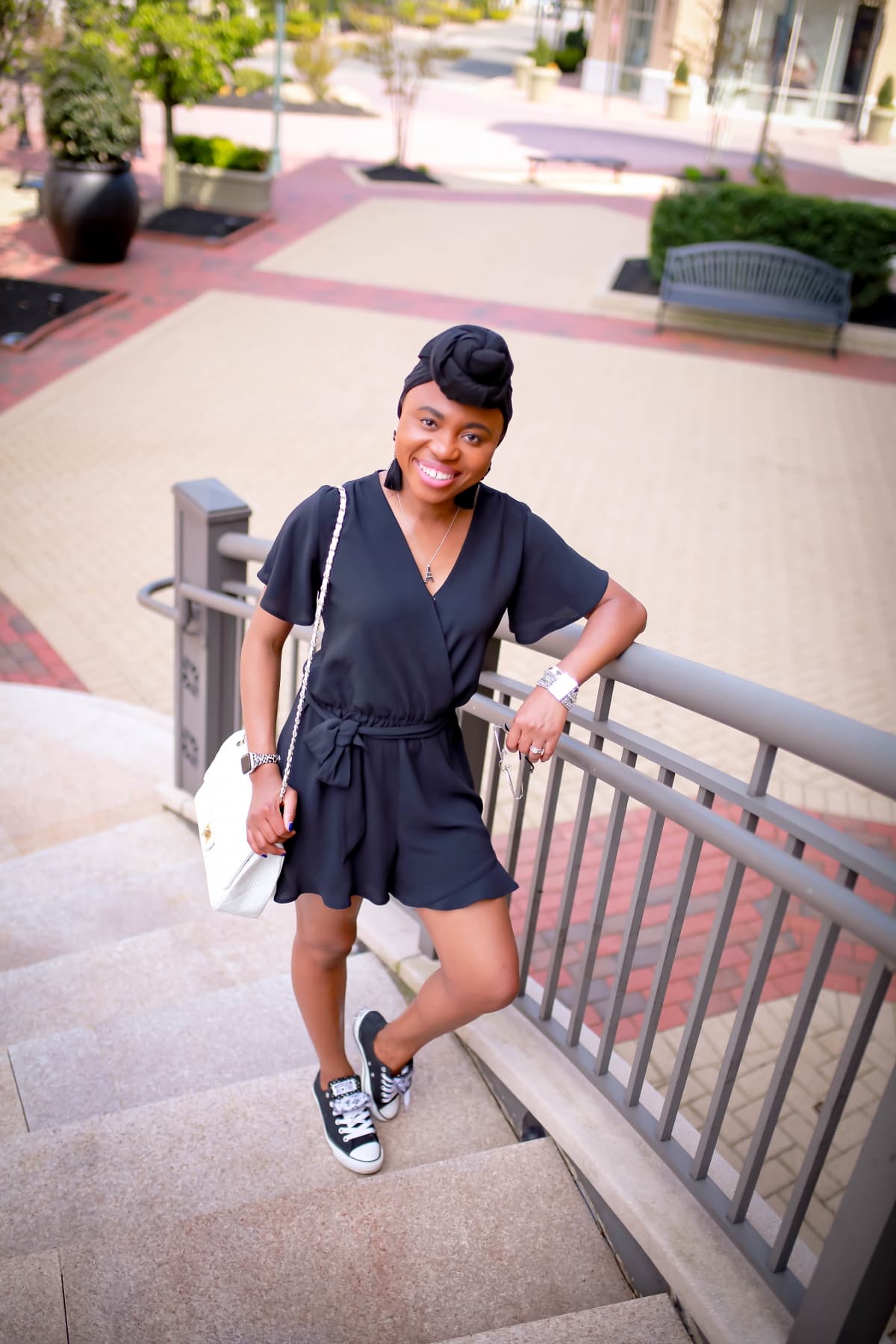 Looking for the perfect summer romper that won’t break the bank? You’ll love this black dressy romper. At a price point under $50, this stunning lightweight is great as a workwear paired with classic flats, as a date night outfit with platform espadrilles, and casual everyday look with a pair of Converse sneakers to run errands. #rompers #summerstyle #blackoutfi