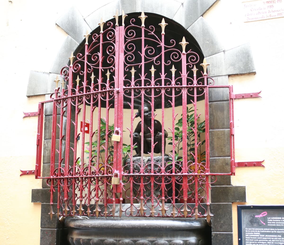 A comprehensive guide on everything you need to know about the Manneken Pis in Brussels including the Peeing Boy clothes, history, Jeanneken Pis including the best time of the day to see Le Petit Julien.
