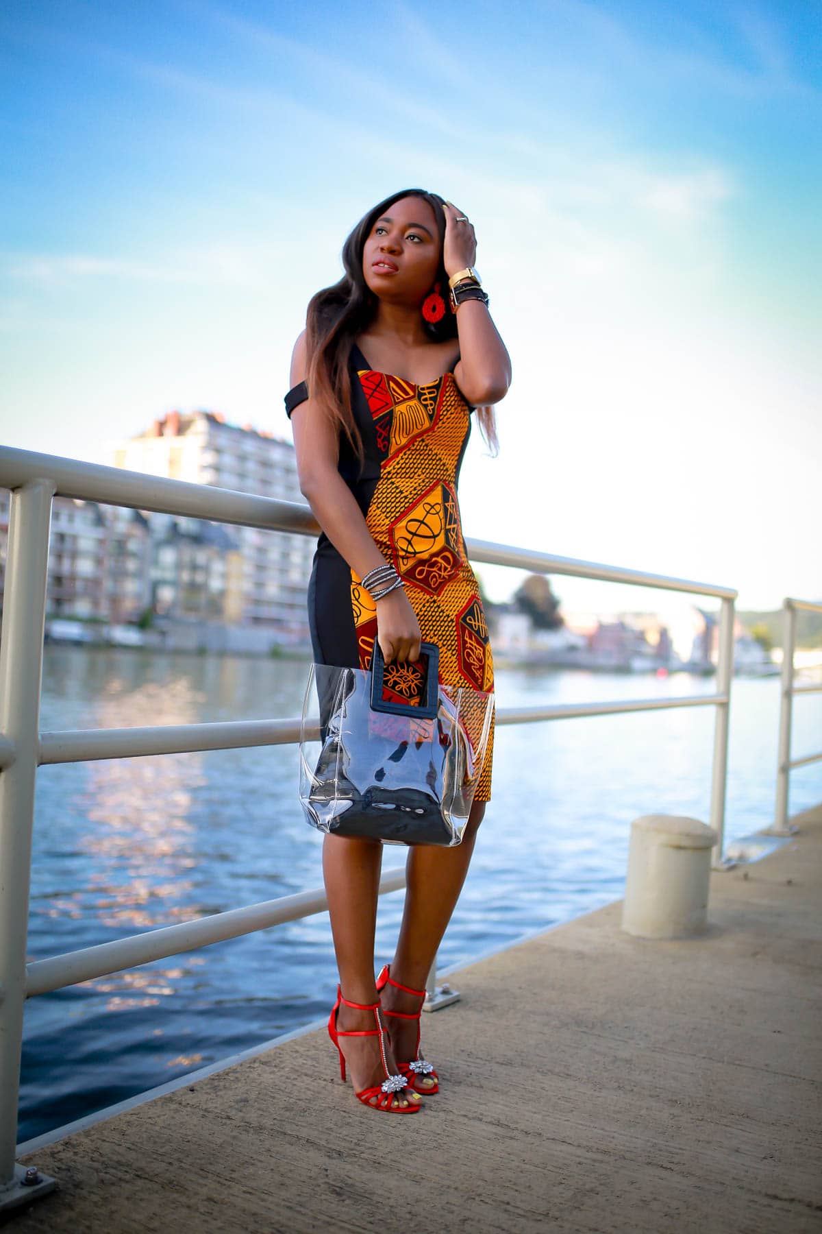 #africanfashionoutfits Totally crushing on this African print sheath dress that is perfect for special events like weddings, birthday parties and more. African fashion lover, Louisa, shares this stunning ankara dress and where to find a similar style. #africanwedding #ankarastyles