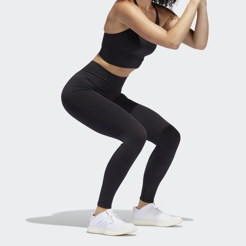 a model working out in an Adidas seamless legging