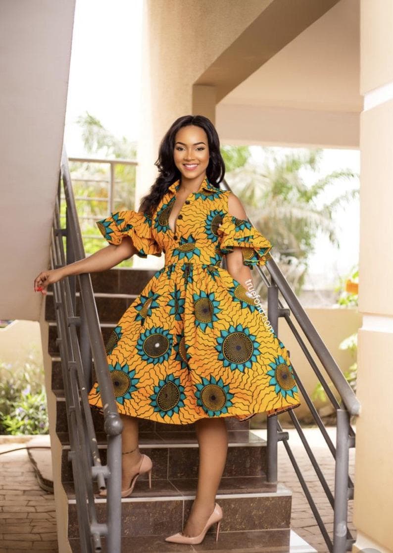 A corporate sexy cold shoulder African print dress