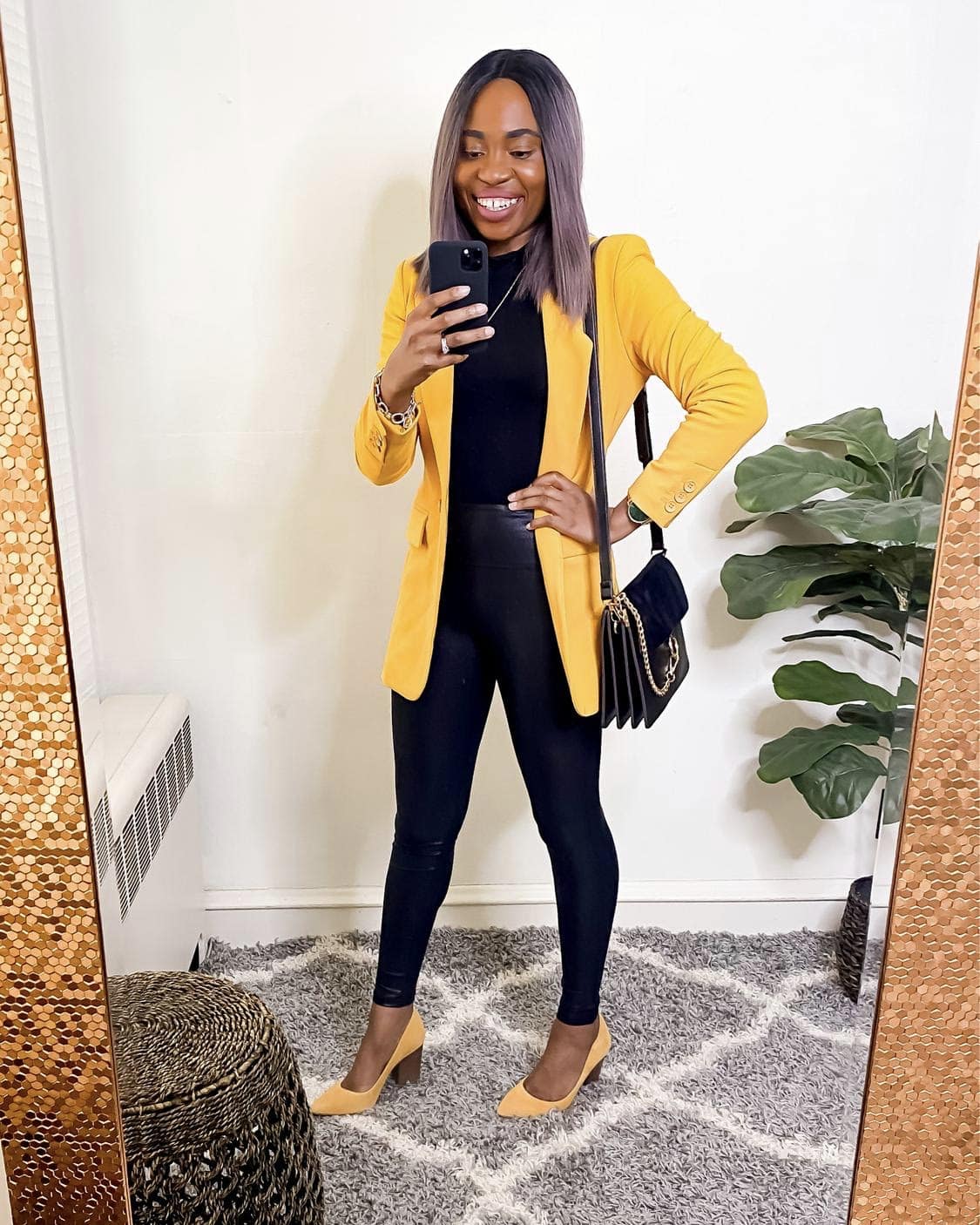 A formal one button yellow jacket paired with a pair of Spanx